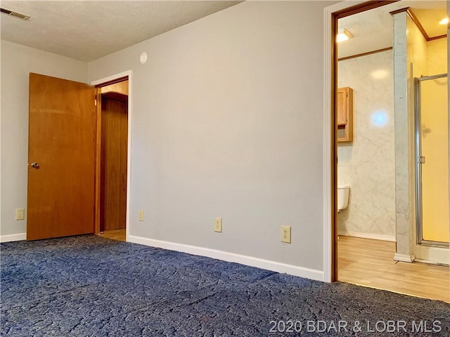 interior space featuring dark colored carpet