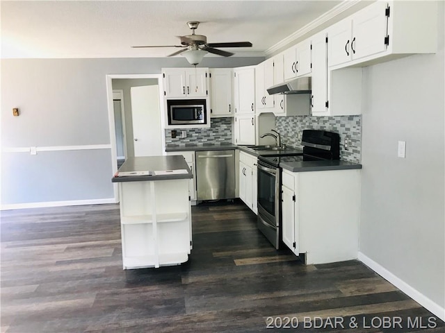 kitchen with white cabinets, ceiling fan, stainless steel appliances, and dark hardwood / wood-style flooring