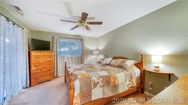 bedroom with light colored carpet and ceiling fan