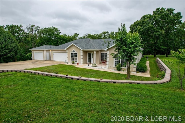 single story home with a front yard and a garage