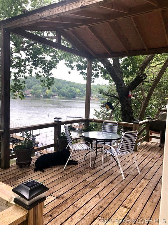 wooden terrace with a water view