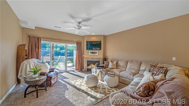 carpeted living room featuring ceiling fan