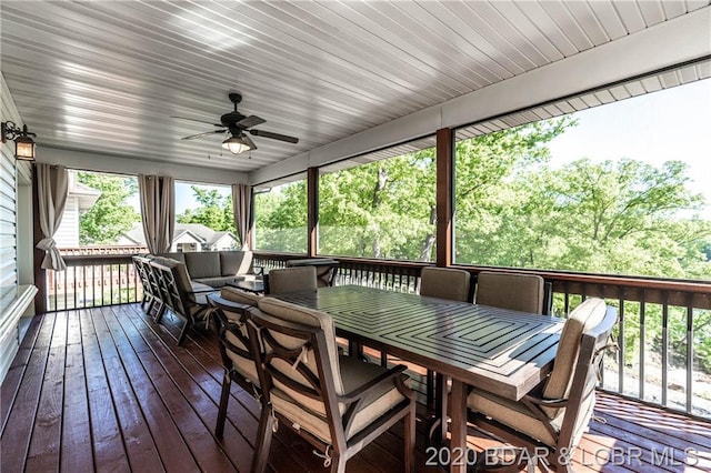 sunroom / solarium with ceiling fan