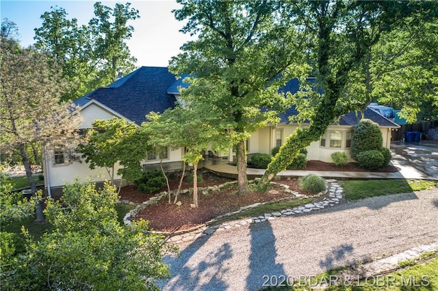 view of property hidden behind natural elements