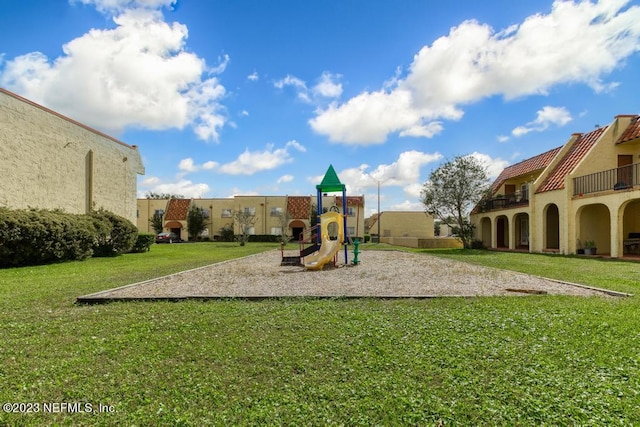 view of play area featuring a yard