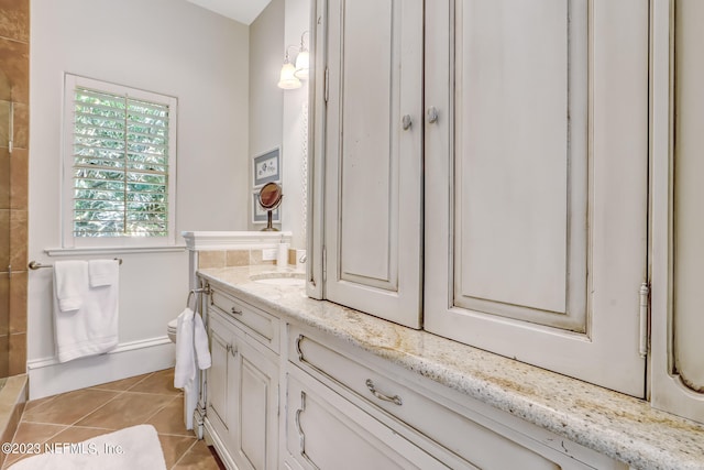 bathroom featuring tile patterned floors and vanity