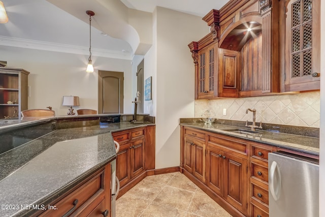 kitchen with light tile patterned flooring, tasteful backsplash, crown molding, sink, and hanging light fixtures