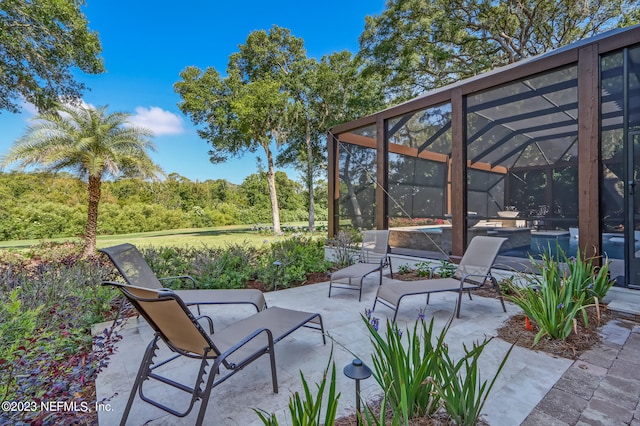 view of patio / terrace with glass enclosure