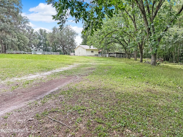 view of yard with a rural view