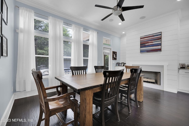 dining area featuring ceiling fan, dark wood-type flooring, and ornamental molding