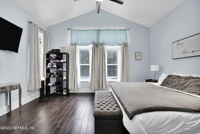 bedroom featuring multiple windows, ceiling fan, dark wood-type flooring, and lofted ceiling