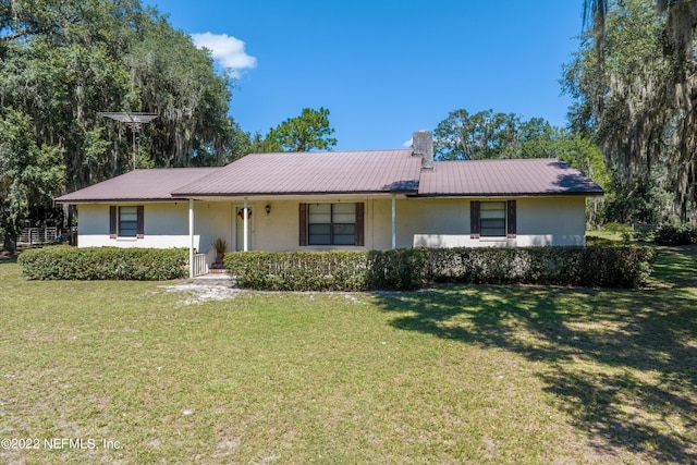 ranch-style house featuring a front lawn