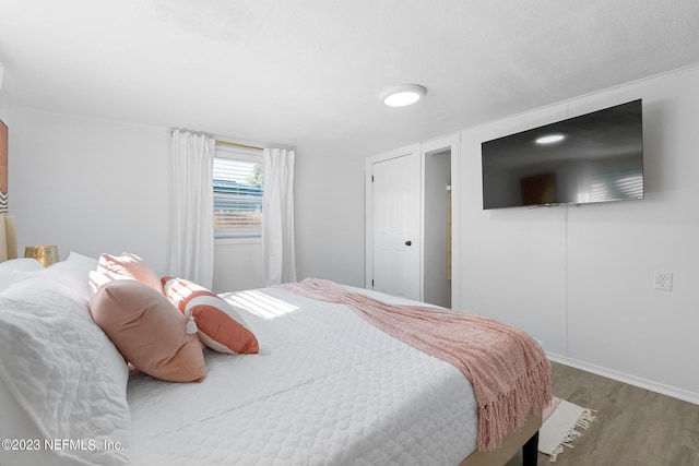 bedroom featuring hardwood / wood-style floors