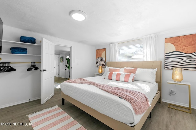 bedroom featuring wood-type flooring