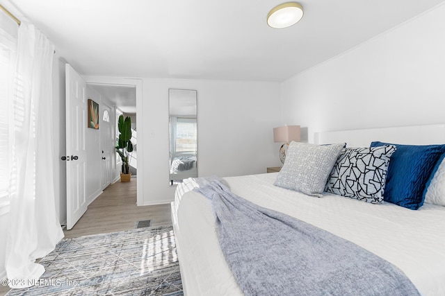 bedroom featuring hardwood / wood-style flooring