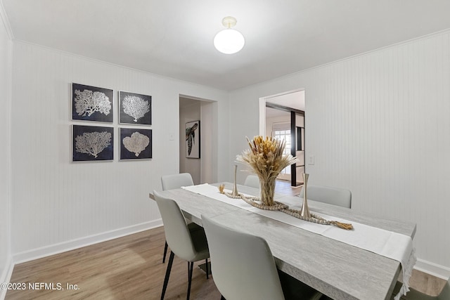 dining area with wood-type flooring