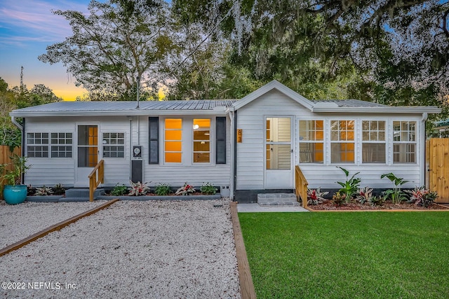 view of front of home featuring a yard