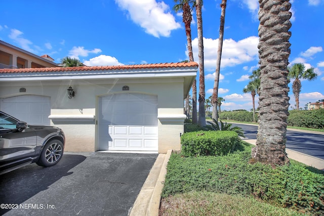 view of side of property with a garage