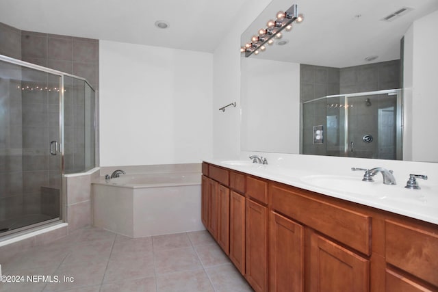 bathroom featuring tile patterned floors, shower with separate bathtub, and vanity