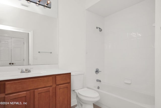 full bathroom with shower / tub combination, vanity, and toilet