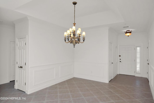 interior space with crown molding, light tile patterned floors, and a notable chandelier