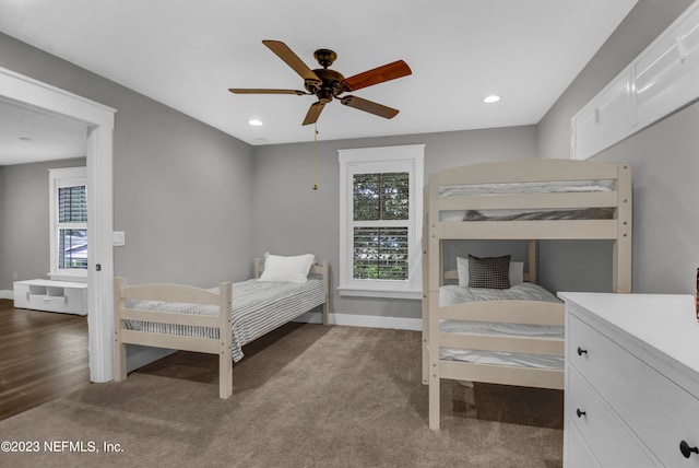 bedroom featuring dark wood-type flooring and ceiling fan