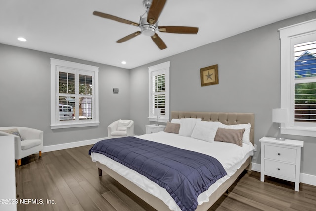 bedroom with dark wood-type flooring and ceiling fan