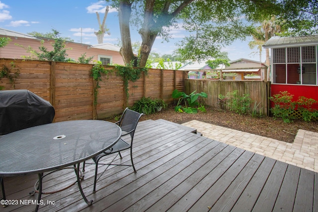 wooden terrace with grilling area