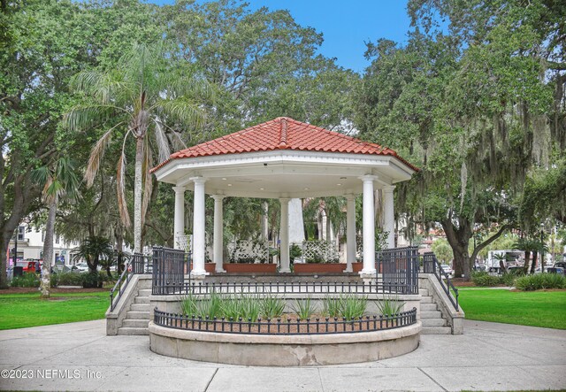 view of property's community featuring a lawn and a gazebo