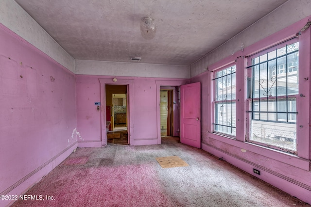 unfurnished bedroom with light colored carpet