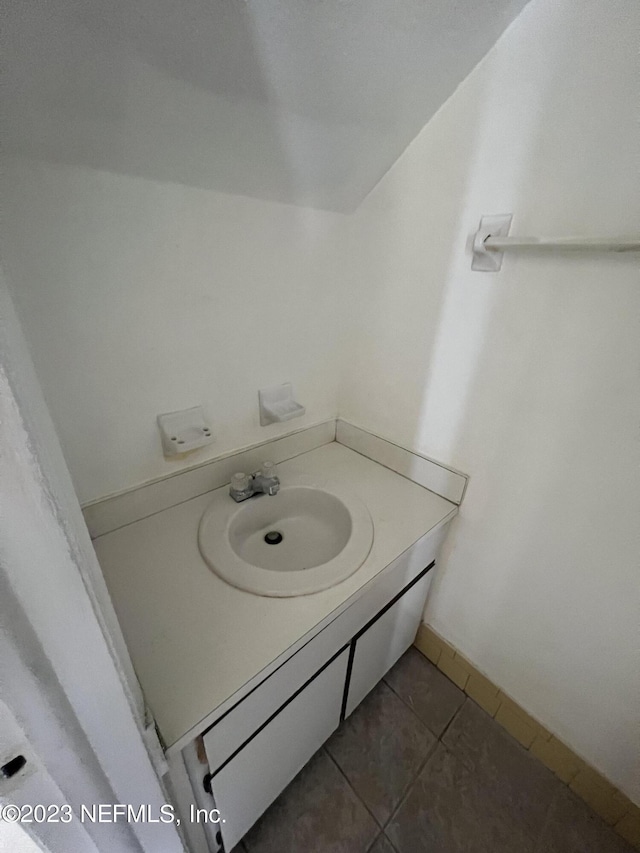 bathroom featuring sink and tile patterned flooring