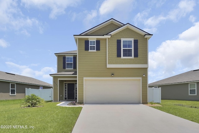 view of front of house with a garage and a front lawn