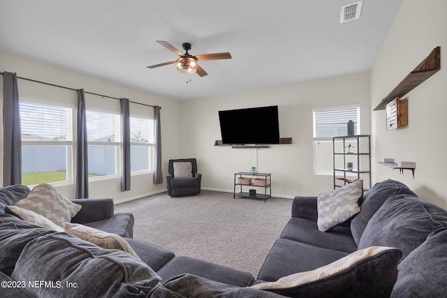 living room with carpet floors and ceiling fan