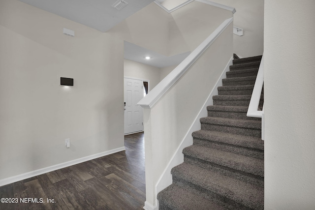 stairs with hardwood / wood-style floors