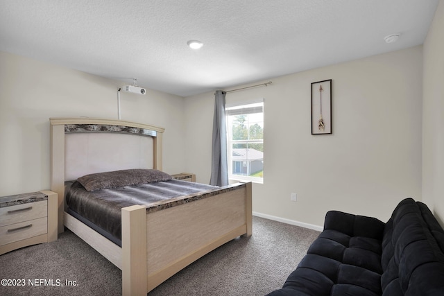 carpeted bedroom with a textured ceiling