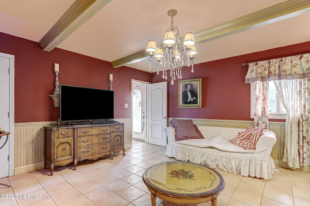 tiled living room featuring beamed ceiling and a notable chandelier