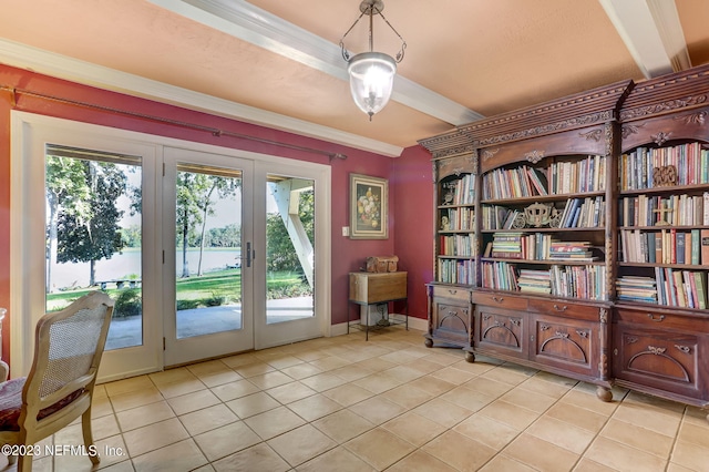 doorway with crown molding and light tile patterned floors