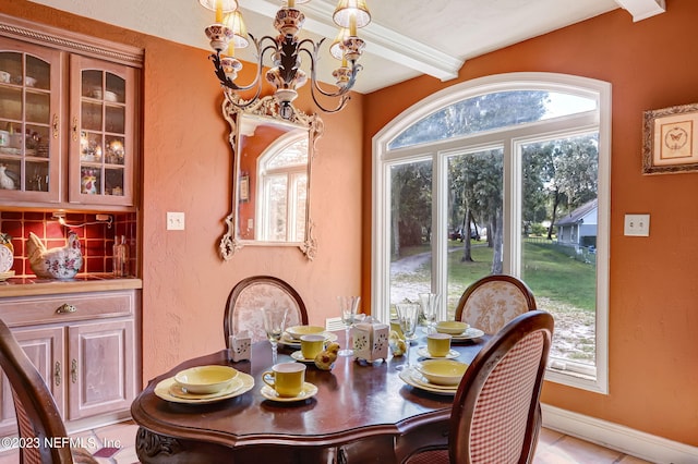 tiled dining room featuring a notable chandelier, a wealth of natural light, and beamed ceiling