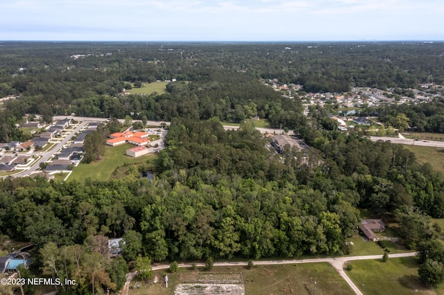 aerial view with a wooded view