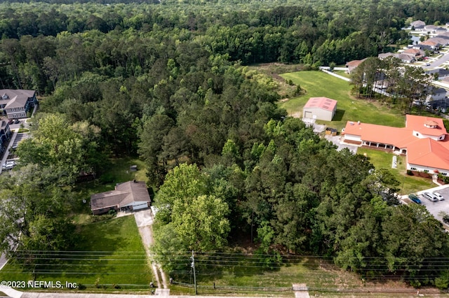 aerial view featuring a view of trees