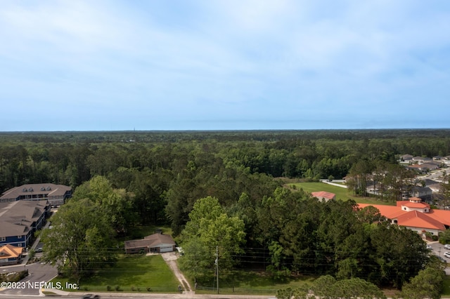 drone / aerial view featuring a view of trees