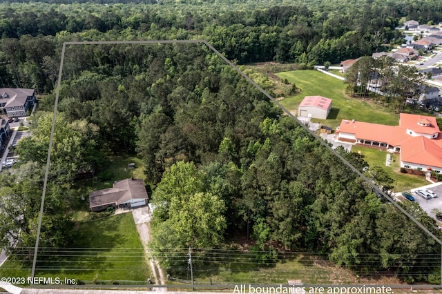 aerial view with a wooded view