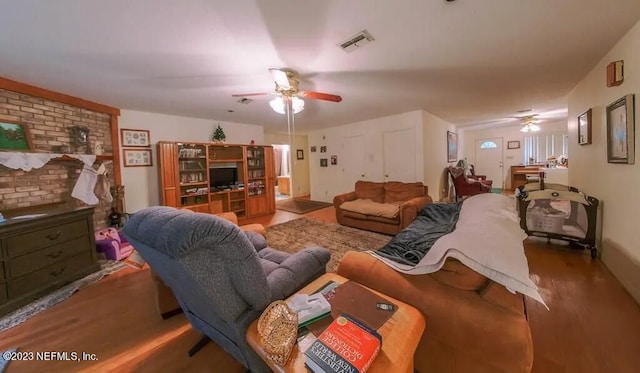 living room with light hardwood / wood-style flooring and ceiling fan