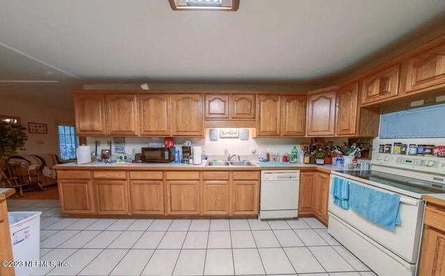 kitchen featuring sink and white appliances