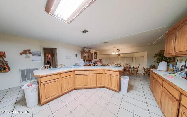 kitchen featuring light tile patterned flooring