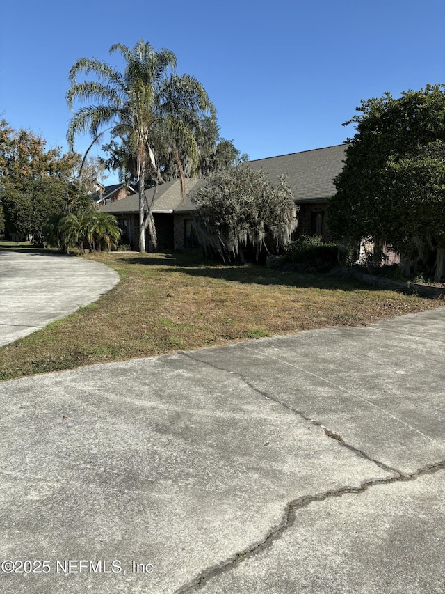 exterior space with a front lawn