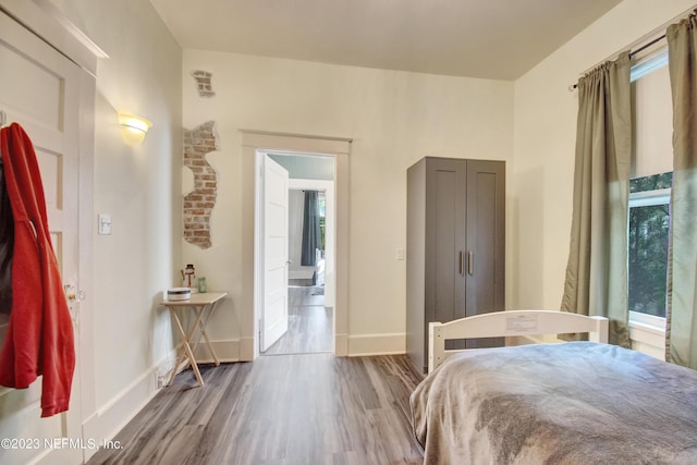 bedroom with wood-type flooring