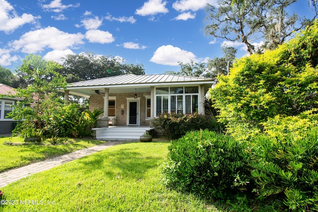 view of front of house featuring a front yard and covered porch