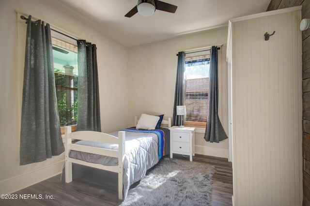 bedroom featuring dark wood-type flooring and ceiling fan