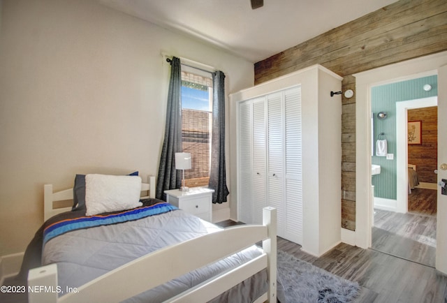 bedroom with a closet and wood-type flooring